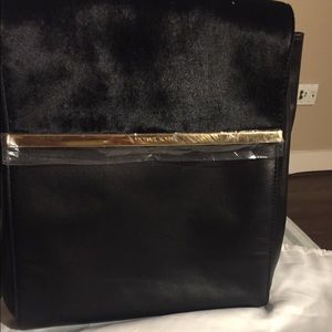 Leather and faux fur MK backpack